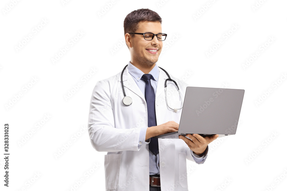 Doctor standing and using a laptop computer Doctor standing and using a laptop computer