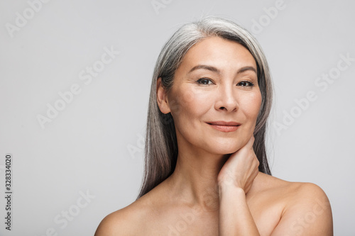Beauty portrait of an attractive mature topless woman