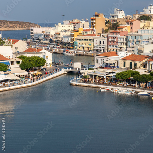 Fototapeta Naklejka Na Ścianę i Meble -  top view of a quiet bay and the Greek resort town of Agios Nikolaos on a sunny summer day