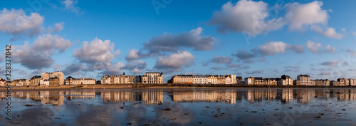 St. Malo, France, July, 27 2019: The panoramic view of the promenade in the St. Malo on summer evening.