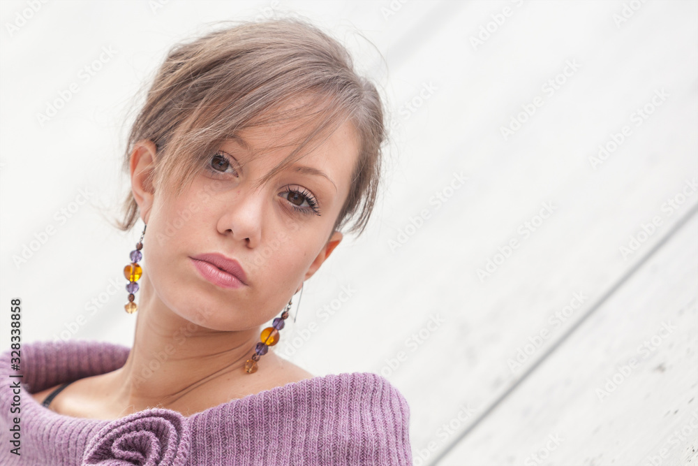 Fototapeta premium Portrait of an attractive young woman thinking