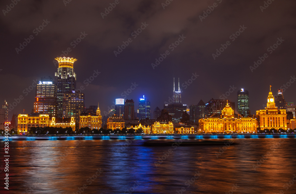 Shanghai Bund reflected in Huangpu river in China 
