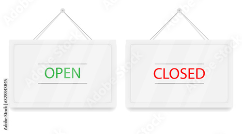 Red Closed and green Open hanging door signs. White sign with shadow