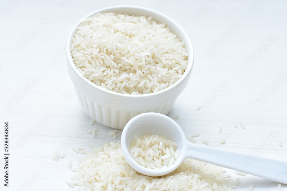 Natural raw white rice grains, on display in bowl Natural raw white rice grains, on display in bowl