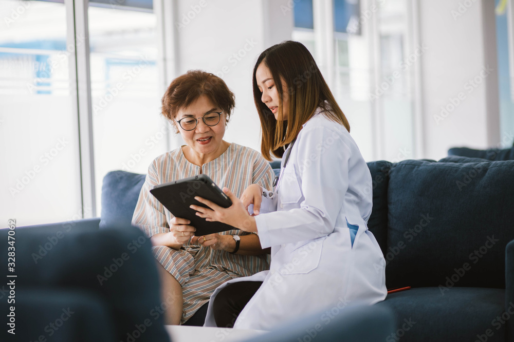 Young doctor consulting senior patient at health care clinic Young doctor consulting senior patient at health care clinic