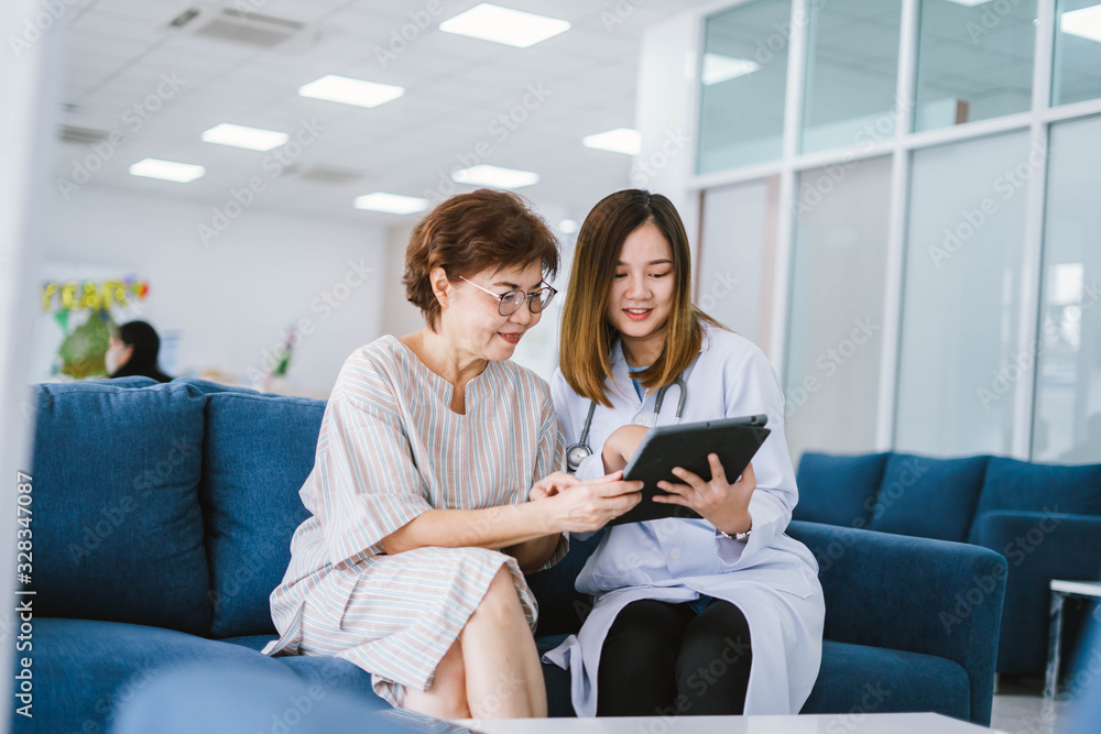 Young doctor consulting senior patient at health care clinic Young doctor consulting senior patient at health care clinic