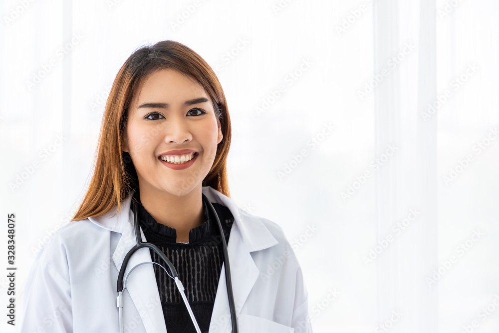 Portrait of a smiling Asian medical doctor looking at camera Portrait of a smiling Asian medical doctor looking at camera