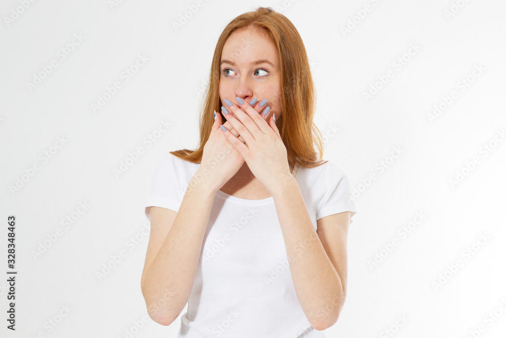 Young red-head woman covering her mouth, isolated on white, girl talk too much Young red-head woman covering her mouth, isolated on white, girl talk too much