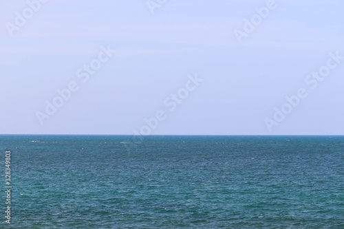 Blue Colored Water In Indian Ocean In Rameswaram Pamban Island India And Sky At Horizon