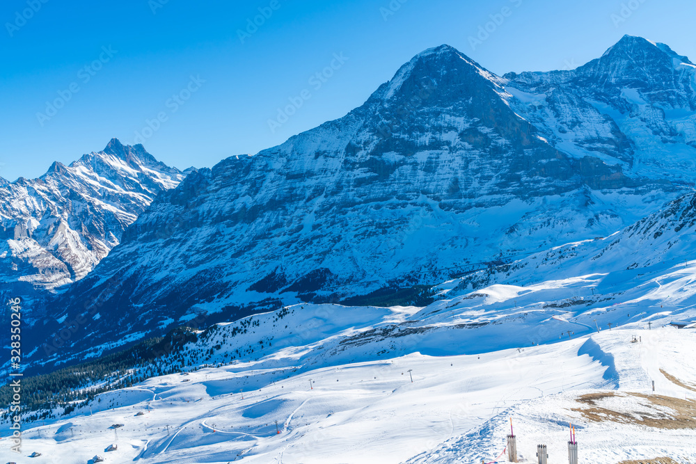 Parnoramic view of snow covered Swiss Alps from Mannlichen summit. Winter in Switzerland