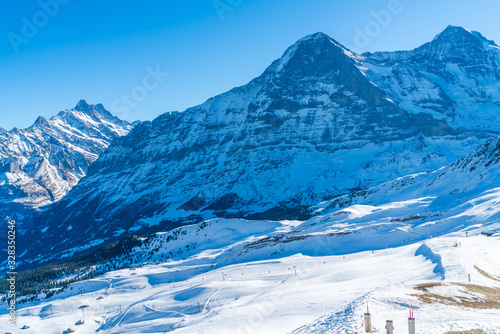 Parnoramic view of snow covered Swiss Alps from Mannlichen summit. Winter in Switzerland