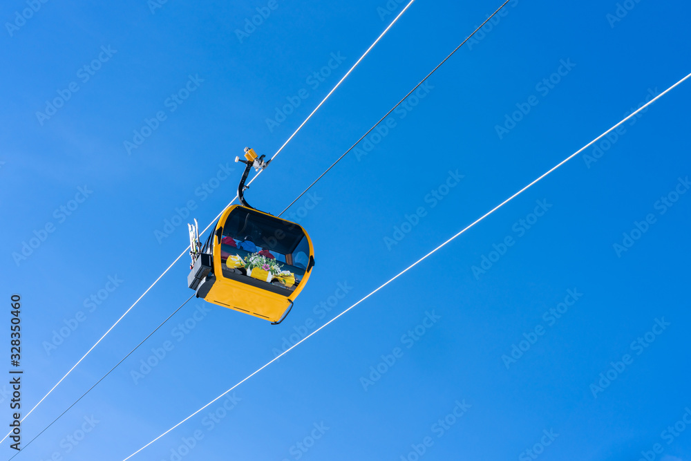 Cableway gondola against blue sky in Grindlelwald ski resort, Switzerland Cableway gondola against blue sky in Grindlelwald ski resort, Switzerland