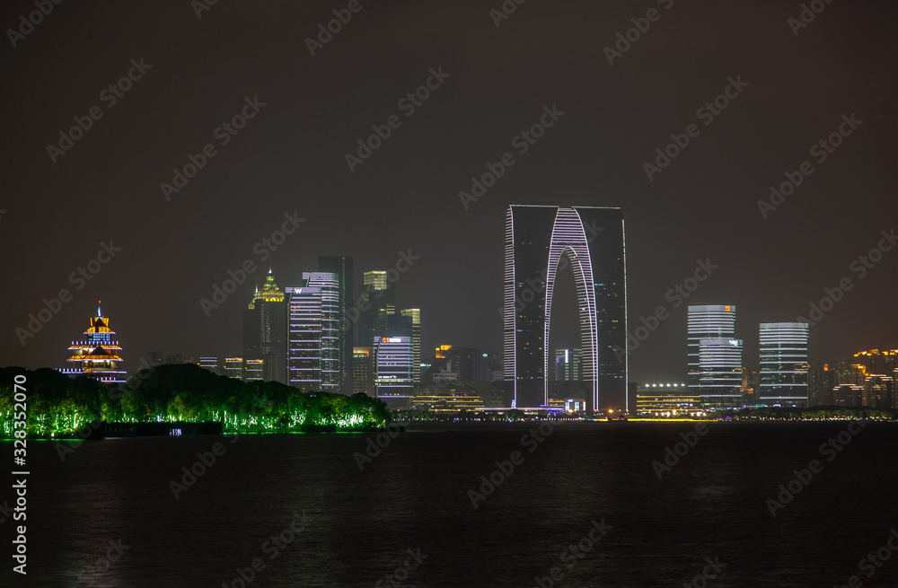 Fototapeta premium Soochow reflects in Jinji Lake in Jiangsu of China 