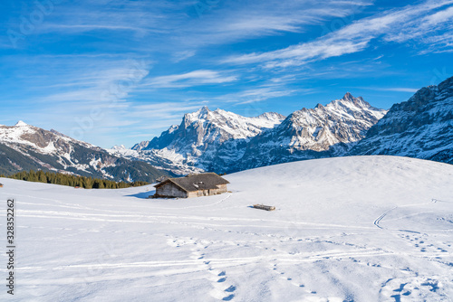 Winter landscape with snow Swiss Alps from Mannlichen mountain in Grindelwald ski resort. Winter in Switzerland