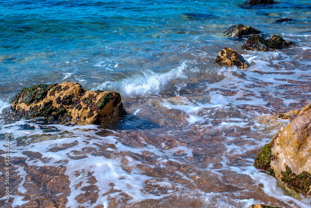 small waves on the shore with stones, Athens, Greece small waves on the shore with stones, Athens, Greece