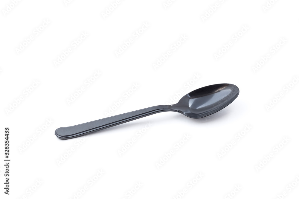 Single small black plastic baby teaspoon isolated from white background Single small black plastic baby teaspoon isolated from white background