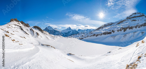 Wide parnoramic view of snow covered Swiss Alps in Grindelwald ski resort  Switzerland