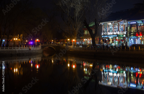 Beijing old city with Chinese restaurants by river  photo