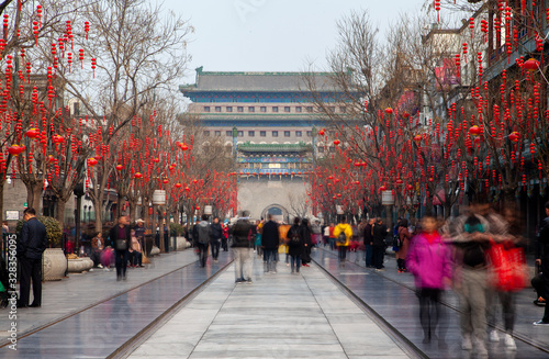 Chinese people wander along Beijing Qianmen street 