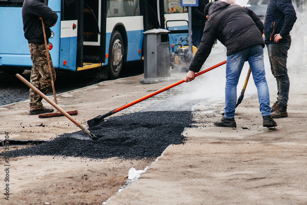 workers in the city lay asphalt workers in the city lay asphalt