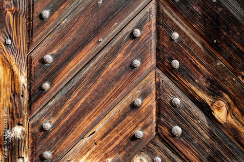 Texture od wooden planks. Wall made of antique wood. Raw wood after century.