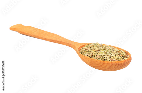 Dry rosemary in a spoon