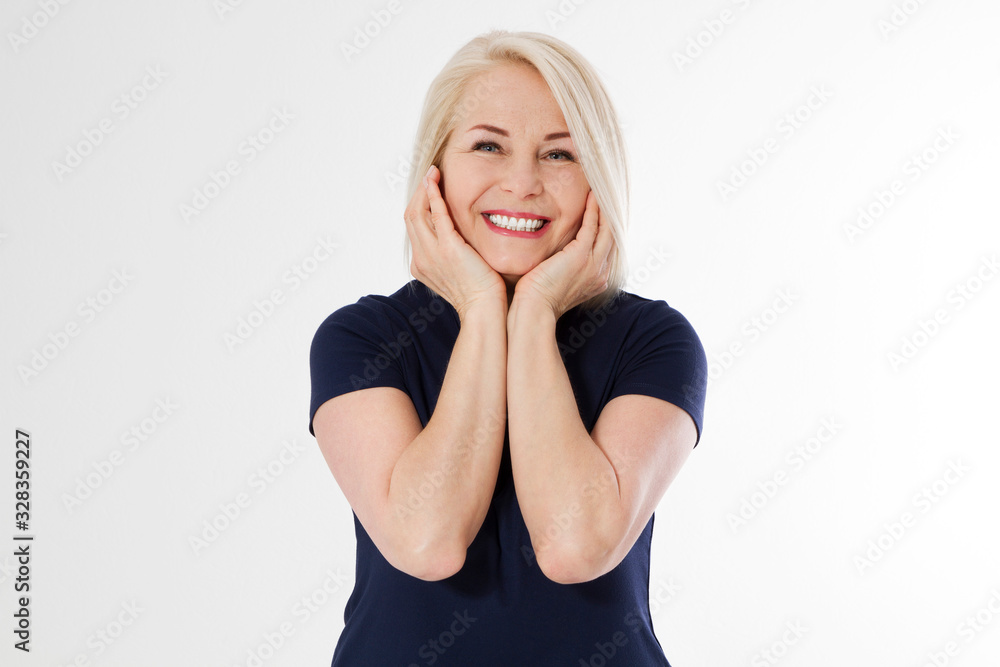 Beautiful middle-aged woman with excellent skin holds her face with palms closeup. Beautiful middle-aged woman with excellent skin holds her face with palms closeup.