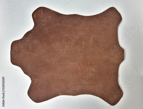 Piece of leather on white background photo