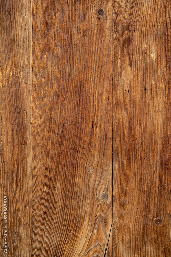 Naklejka premium Texture od wooden planks. Wall made of antique wood. Raw wood after century.