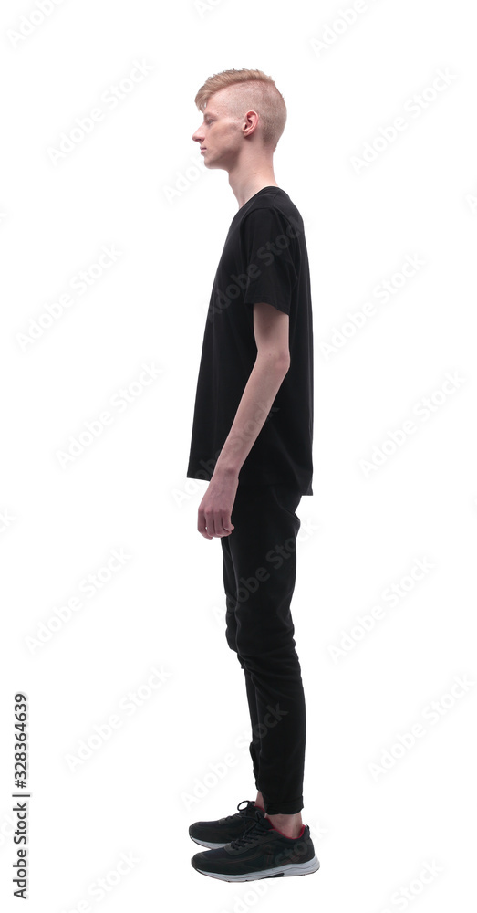 side view. casual student guy looking forward.