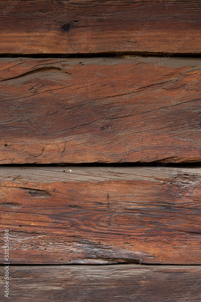 Fototapeta premium Texture od wooden planks. Wall made of antique wood. Raw wood after century.