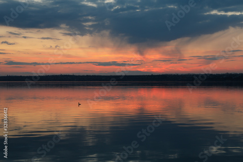 Amazing sunset with clouds and river. Nature background © Atlas