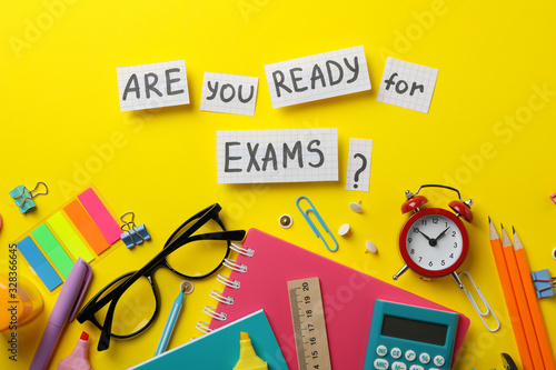 Canvas-taulu Inscription Are you ready for exams? and stationary on yellow background, top vi