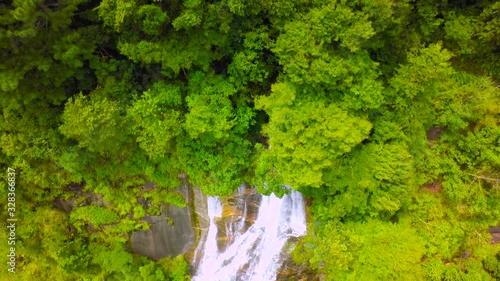 Aerial Shot Beautiful waterfall in the mountain. photo