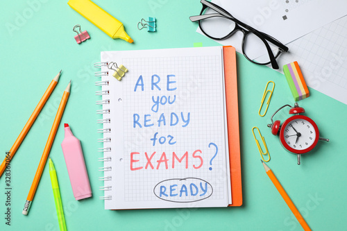 Inscription Are you ready for exams? Ready and stationary on mint background, top view