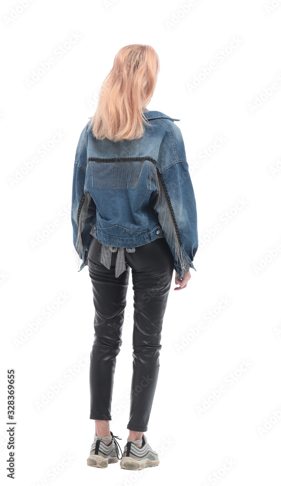 rear view. casual girl looking at blank white wall rear view. casual girl looking at blank white wall
