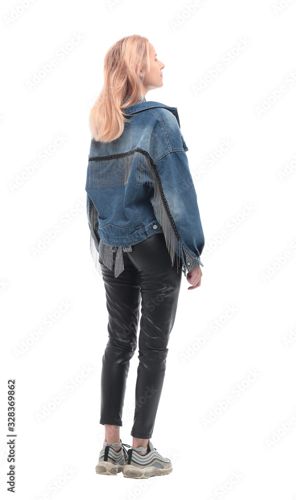 rear view. casual girl looking at blank white wall rear view. casual girl looking at blank white wall