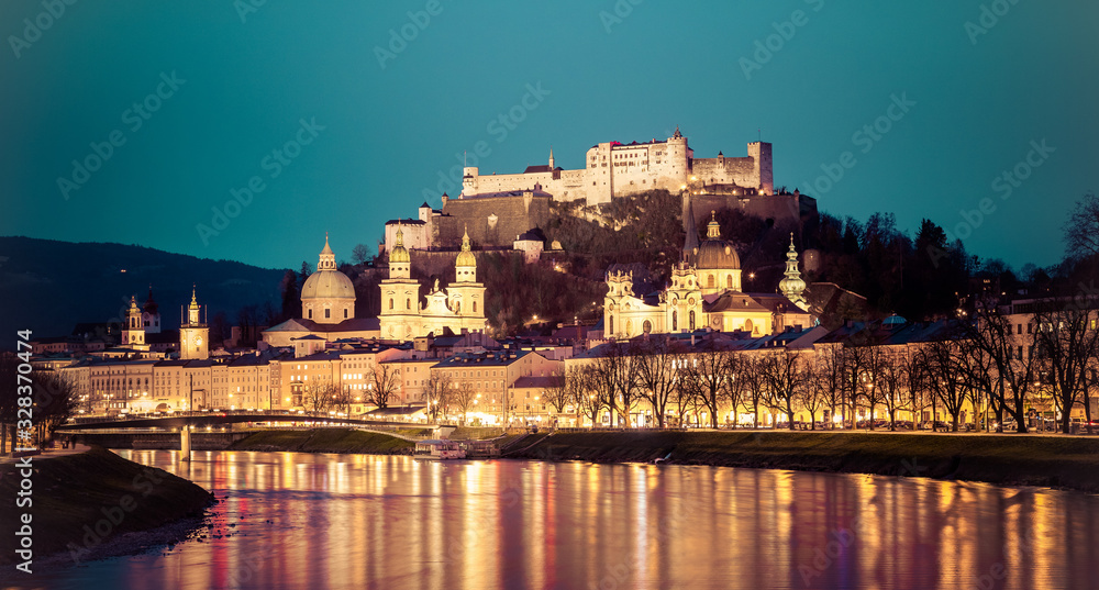 Salzburg old city at dusk: Salzach, fortress Hohensalzburg and Cathedral