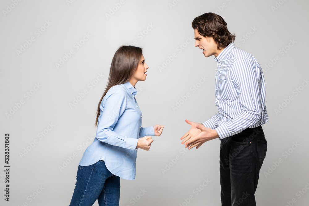 Angry couple shouting at each other qurrel on white background Angry couple shouting at each other qurrel on white background