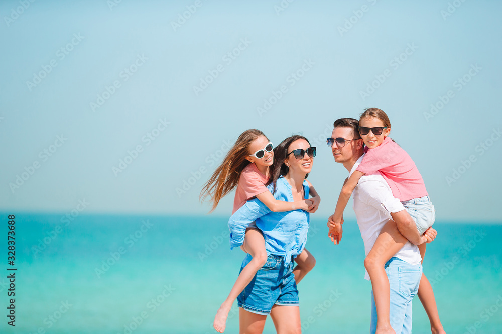Happy family on the beach during summer vacation Happy family on the beach during summer vacation