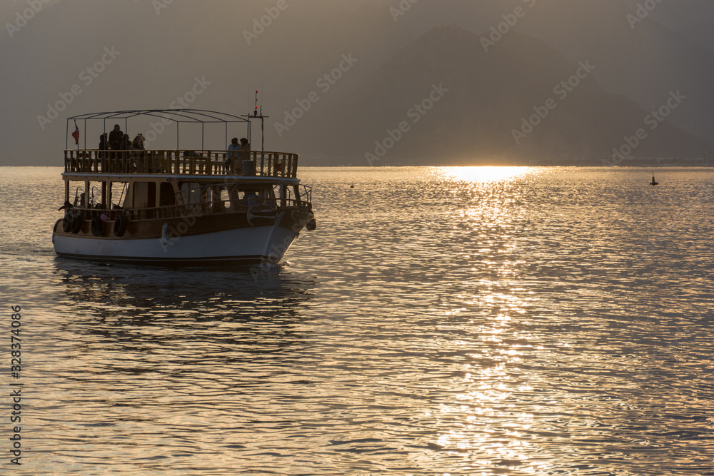 boat at sunset in antalya