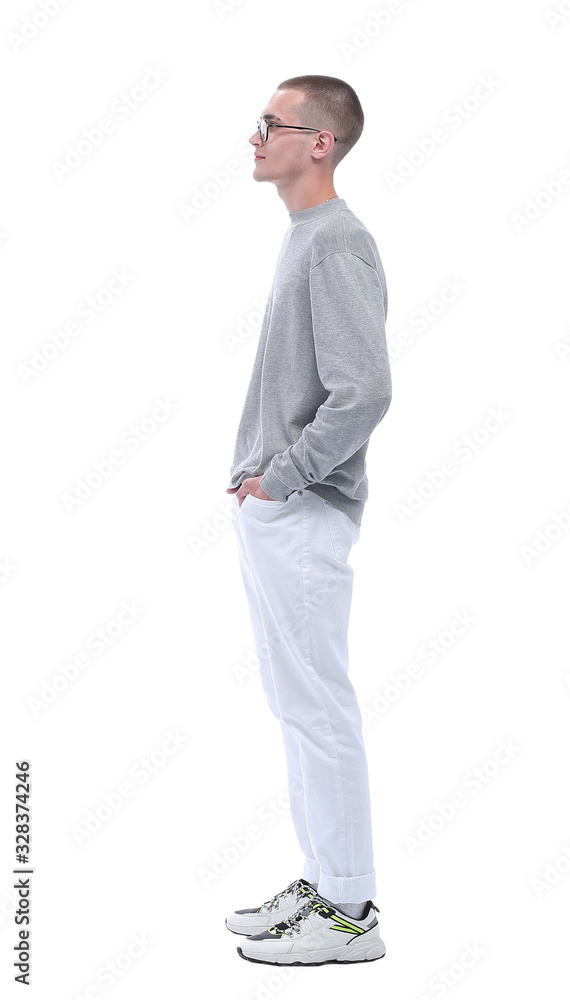 side view. stylish guy in glasses reading something on a white wall side view. stylish guy in glasses reading something on a white wall