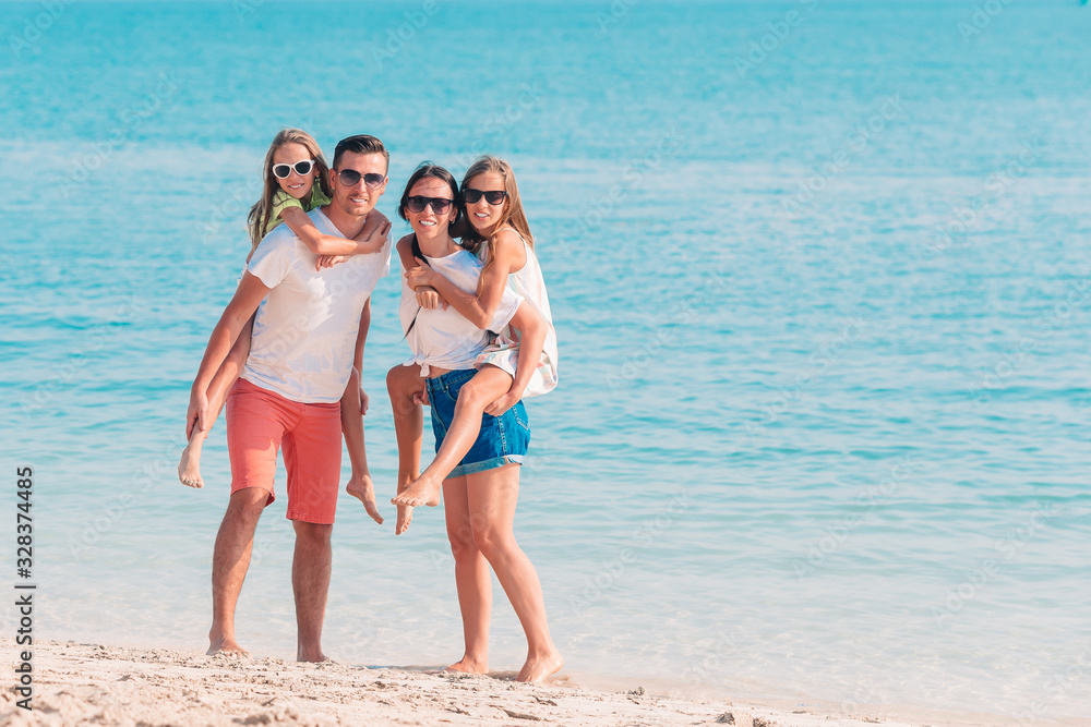 Happy family on the beach during summer vacation Happy family on the beach during summer vacation