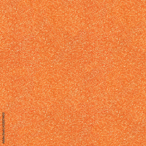 Surface texture with orange sparkles. Seamless festive background. Light backdrop