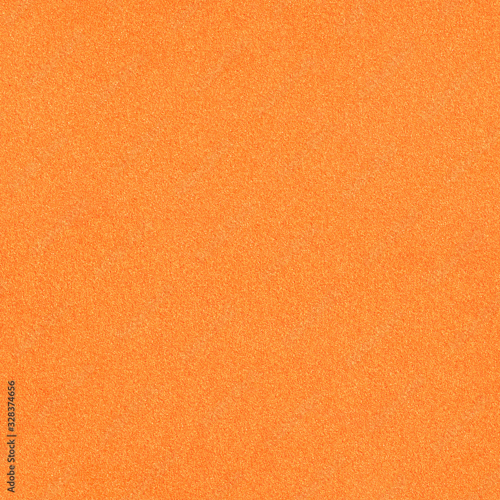 Fototapeta premium The surface texture of foamiran. Orange synthetic sponge material. Bright foam rubber background