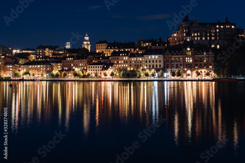 View of Sodermalm with illuminated historical buildings during the night in Stockholm, Sweden.