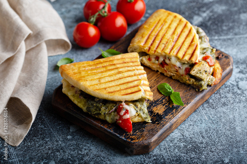 Chicken tomato pesto panini photo