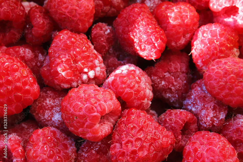 Fresh frozen raspberries. Close-up. Top view. Background. Texture. Fresh frozen raspberries. Close-up. Top view. Background. Texture.