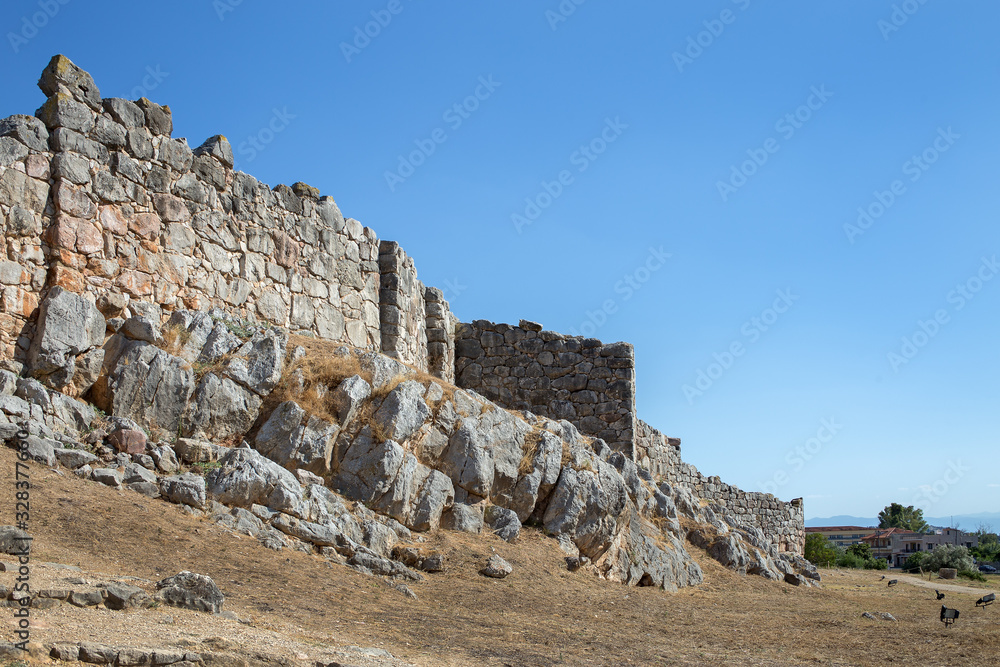 Ruins of ancient acropolis of Tiryns - a Mycenaean archaeological site in Argolis in the Peloponnese, and the location from which mythical hero Heracles performed his 12 labors, Greece.