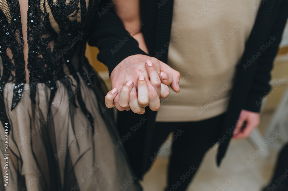 Man and woman hold hands close up. Photography, concept.